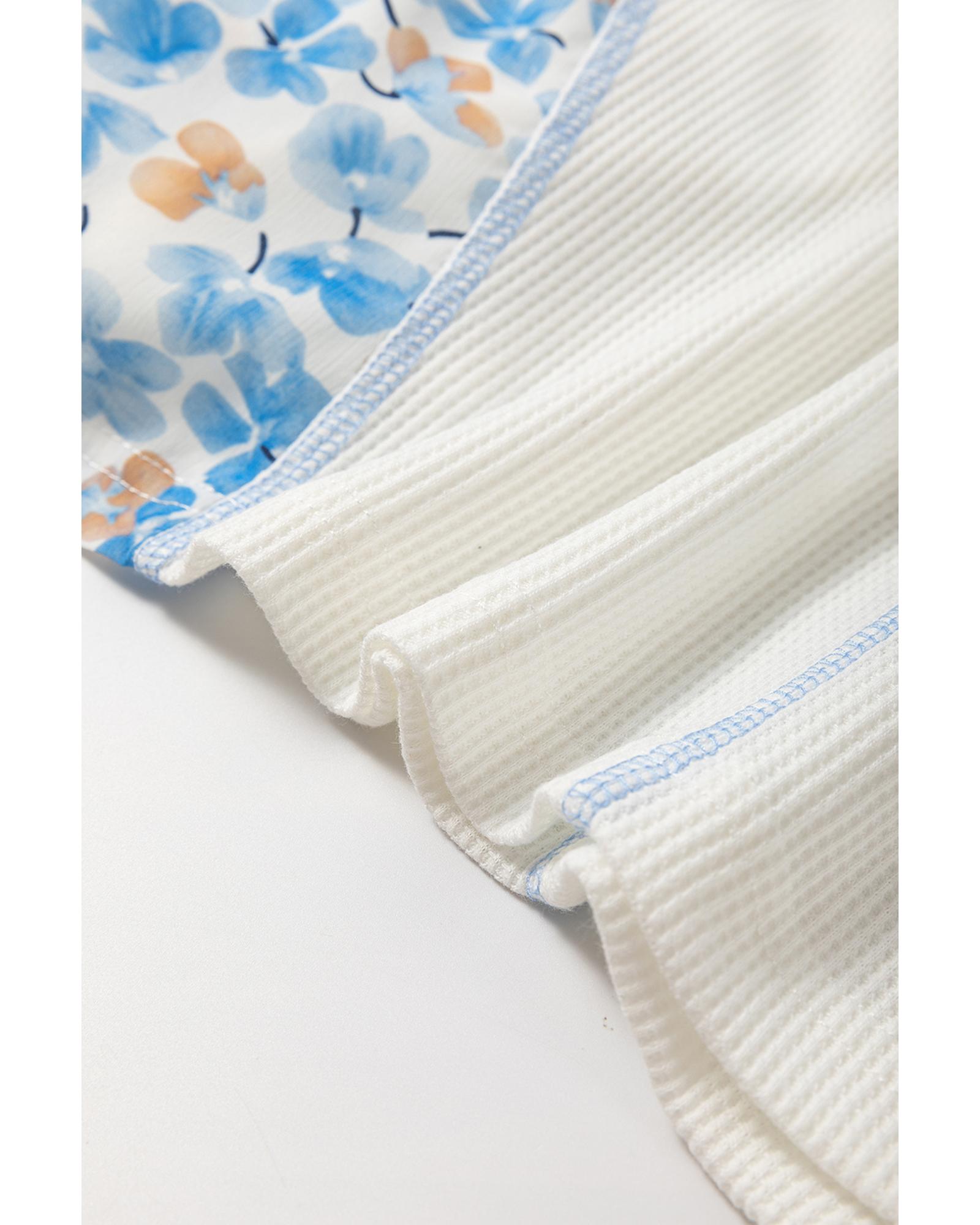 V539-AZEXDC25128384-P1-M-202508272210-00 White Abstract Floral Patchwork Batwing Sleeve V Neck Blouse - M - Image 1