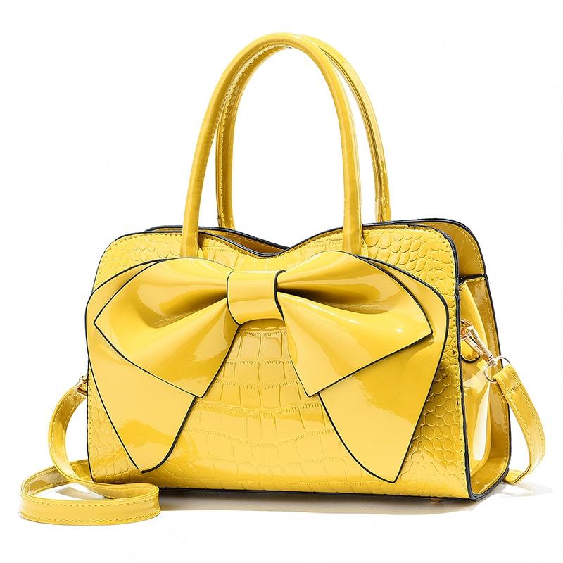 V562-A1040232060DBT-202504251552-00 Leather Ladies Handbag - Bright Bow Design - Yellow - Image 1