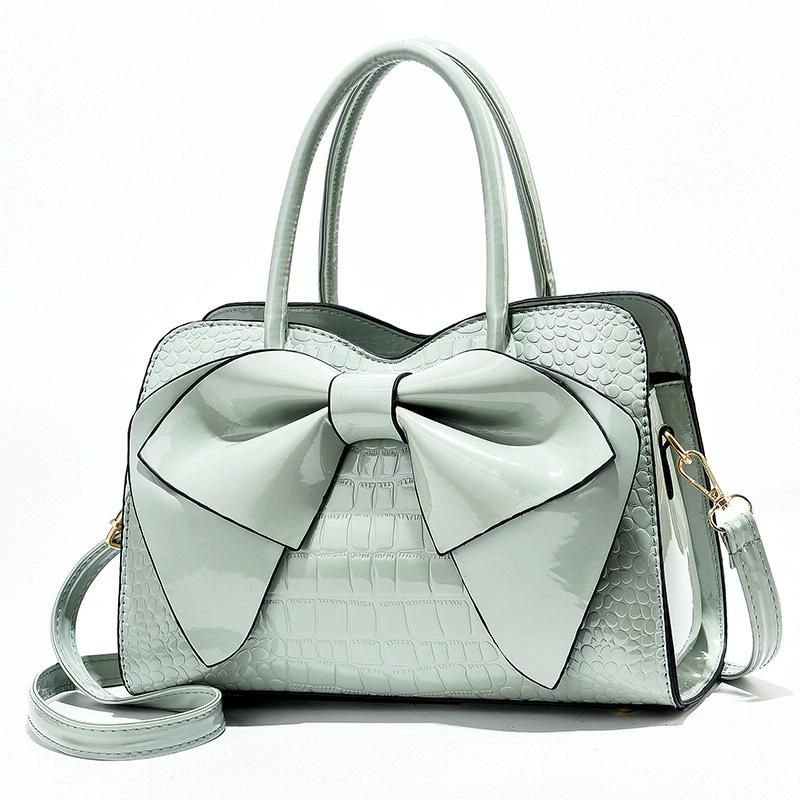 V562-F1040232060DBT-202504251551-00 Leather Ladies Handbag - Bright Bow Design - Light Green - Image 1
