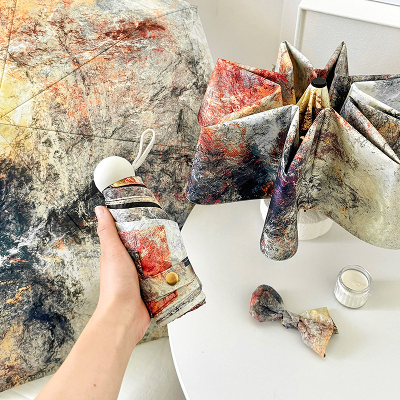 V888-ELOSUNG22294-202503211640-00 Sunburned Rock Mini 5-Fold Umbrella - Portable, Anti-UV, Black Glue Coating - Image 1