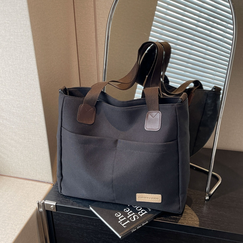 V888-ELOSUNG25003-202504141435-00 Stylish black canvas tote bag with detachable shoulder strap - Image 1