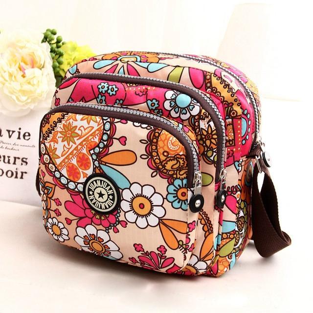 V562-D1039221110DBT-202508291131-00 Waterproof Nylon Multilayer Crossbody Bag For Women - Dream Safflower - Image 1
