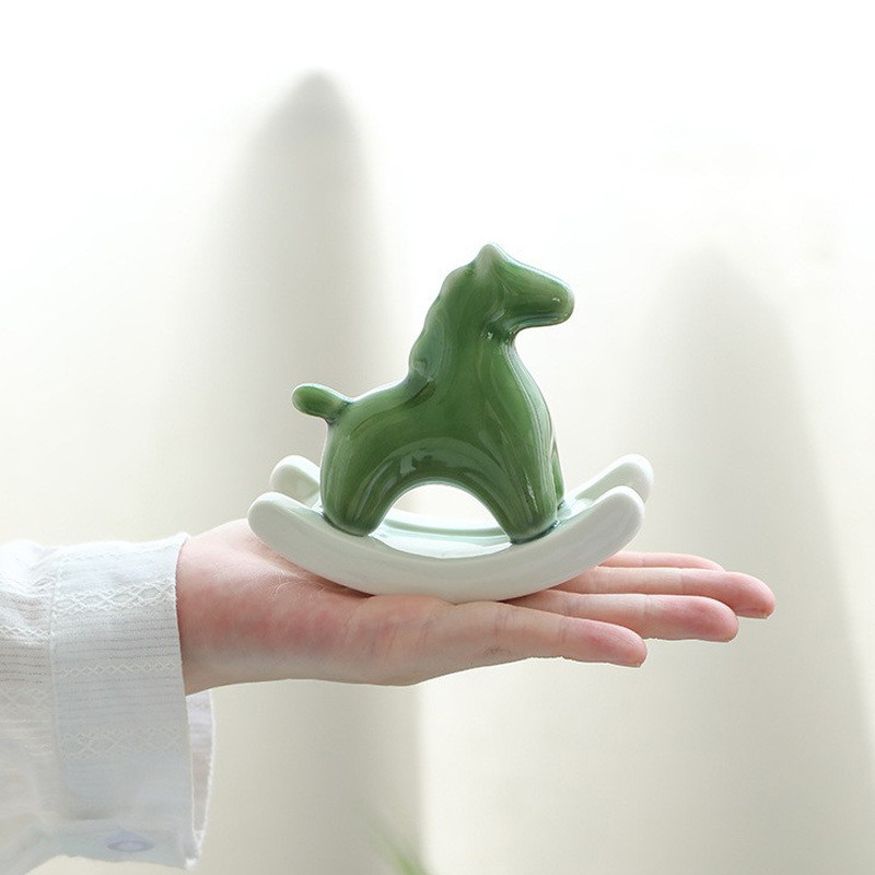 V888-ELOSUNG36156-202508051620-00 Green Modern Ceramic Rocking Horse Ornament - Cute Porcelain Figurine for Desk & Shelf Decor - Image 1